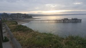 View of the capitola wharf at sun rise from the cliff
